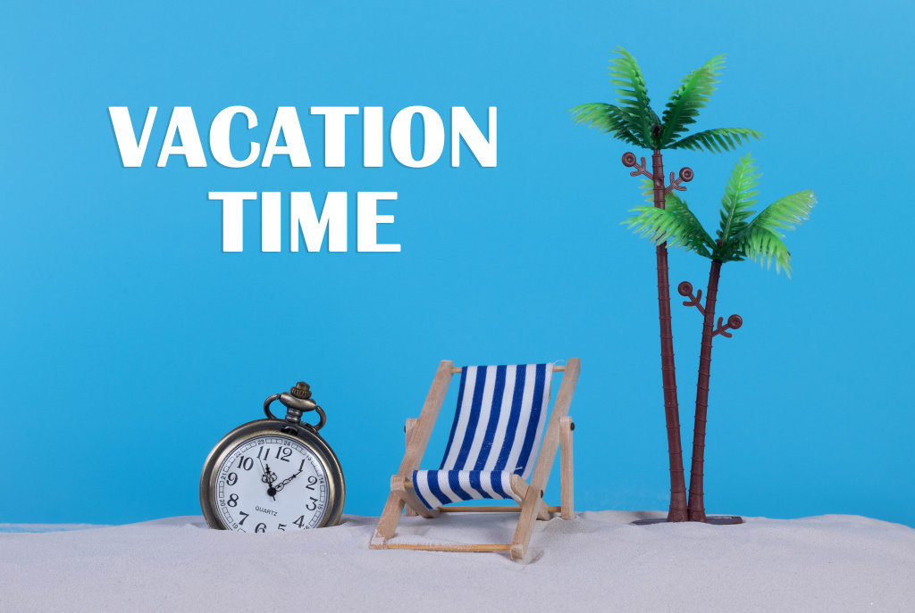 Pocket watch and beach chair with Vacation Time text on blue background