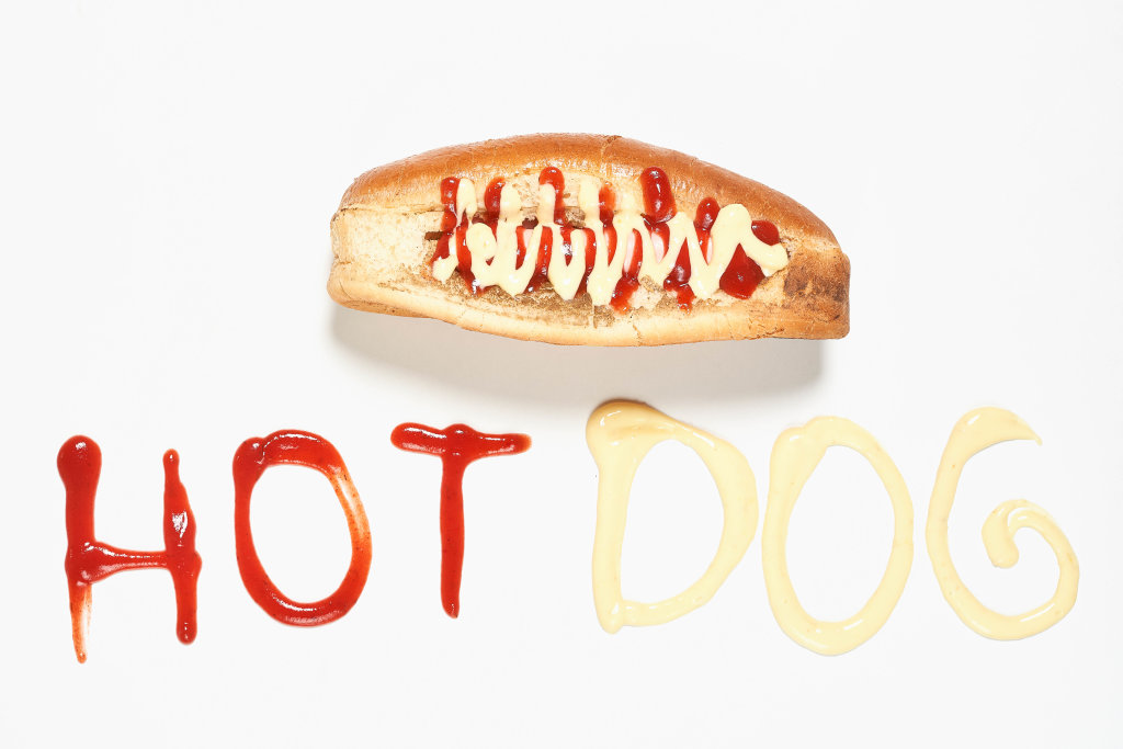 Homemade hot-dog and hotdog inscription made with ketchup and mustard