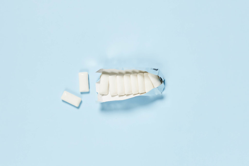 Sugarless chewing gums on bright blue background