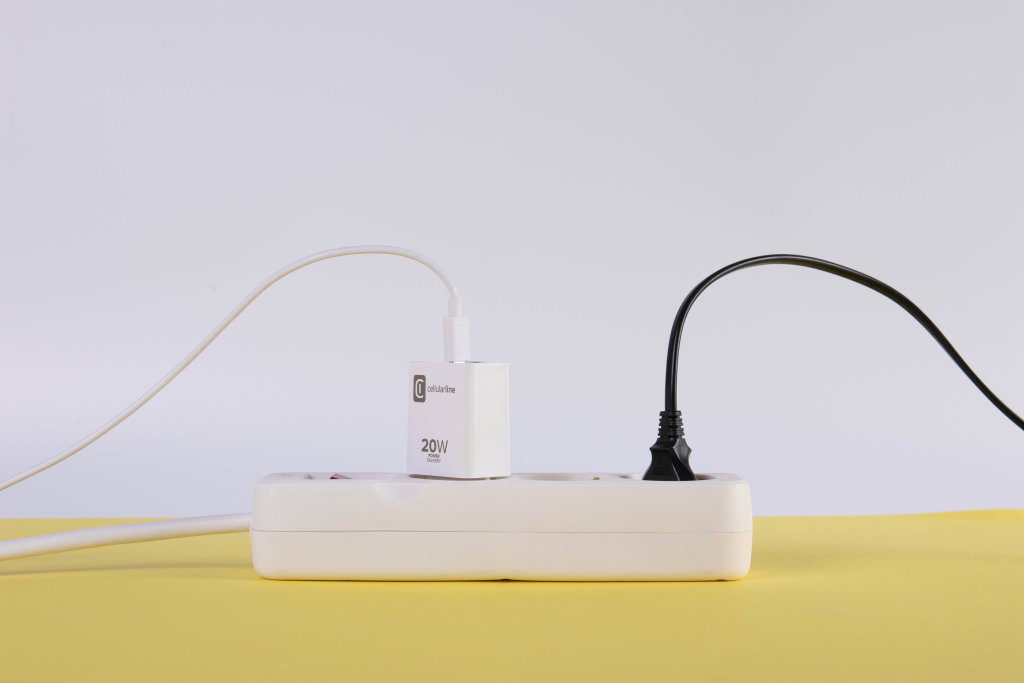 Extension cord on yellow and white background