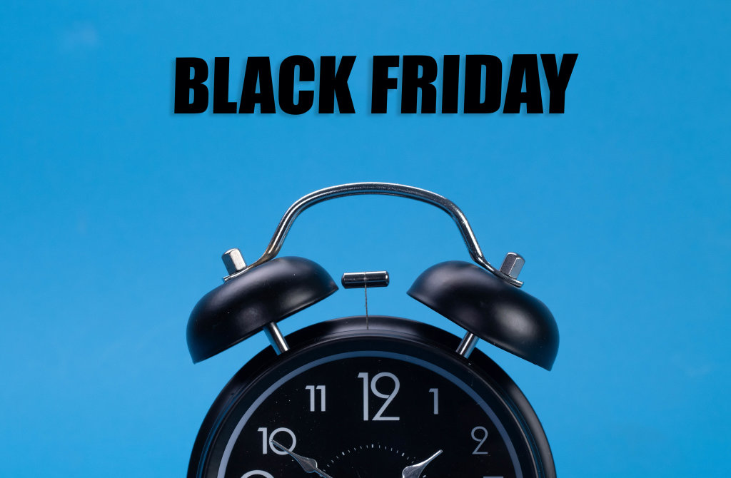 Alarm clock with Black Friday text on blue background