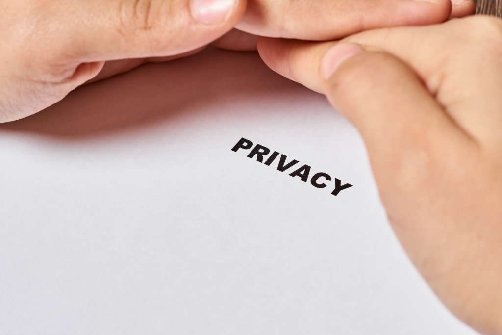 Hand protects privacy text. Privacy, Security of personal data, data protection concepts