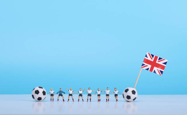 Soccer players with flag of United Kingdom