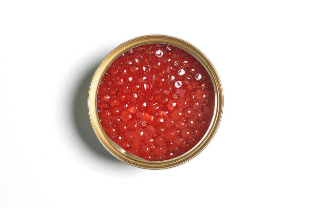 Bowl of red caviar on white