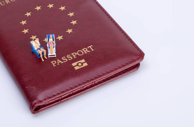 Couple sitting in deck chairs on top of the passport