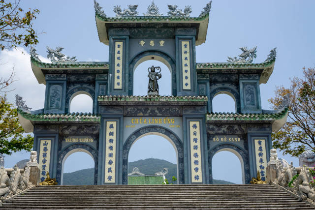 Large Stone Gate in the End of a Stairway with Chinese Letters, Statues and Ornaments at the Linh Ung Pagoda on Son Tra Peninsula in Da Nang, Vietnam