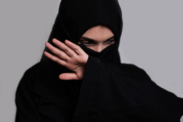 Afghan woman in black islamic clothes