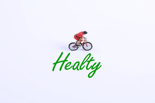 Miniature cyclist with Healty text