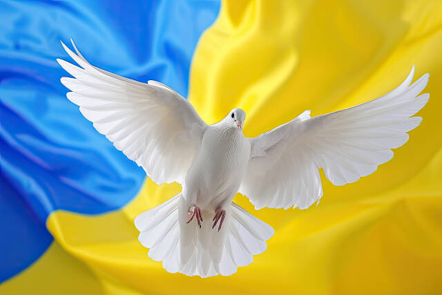 Friedenstaube vor Ukraineflagge