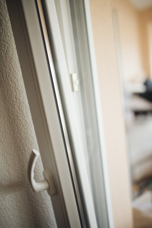 White plastic window frame closeup.