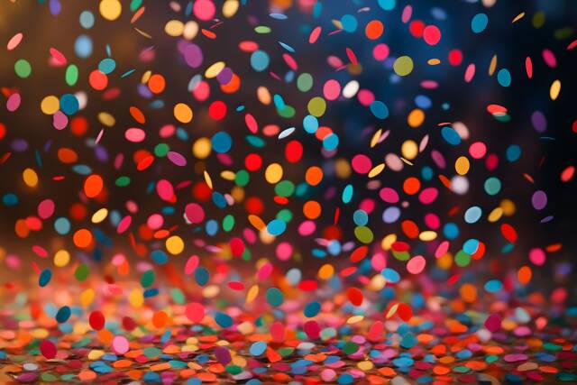 Buntes Konfetti vor dunklem Hintergrund Karneval und Feier