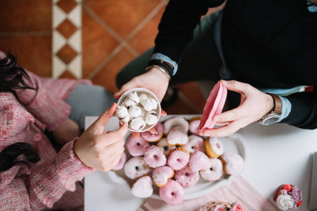 Valentines couple sharing cookie.