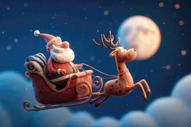 Weihnachtsmann mit Rentier im Schlitten