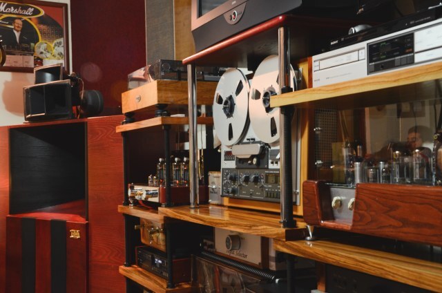A cozy home studio filled with vintage analog hi-fi audio equipment is on display