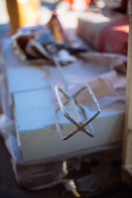 A mixing tool lies on a table